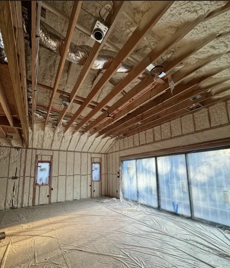 Interior walls and ceiling insulated with spray foam during new construction in Haledon